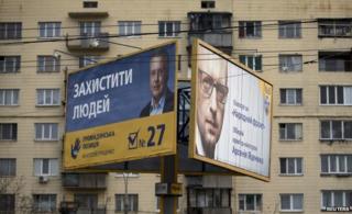 Posters of Anatoliy Hrytsenko (left and Arseniy Yatseniuk in Kiev, 22 October