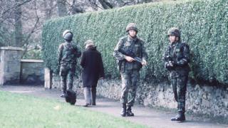 Soldiers on patrol in street