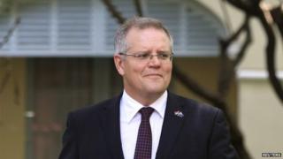 Australia's Immigration Minister Scott Morrison leaves after an interview with Reuters in Phnom Penh 26 September 2014.
