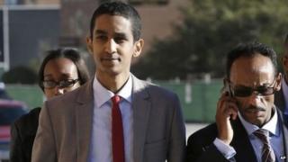 Robel Phillipos, front left, a college friend of Boston Marathon bombing suspect Dzhokhar Tsarnaev, arrives at federal court with defence attorney Derege Demissie, right, on a day of jury deliberations in his trial, Monday, Oct. 27, 2014, in Boston