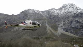 A helicopter takes off at the foot of the mountain called Mannen near Andalsnes, Norway, on 27 October 2014.