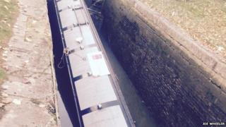 Sunken boat in canal