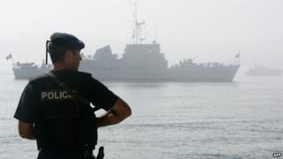 Portuguese warship and policeman - archive pic