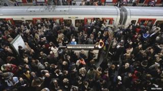 Passengers board a train in Earls Court