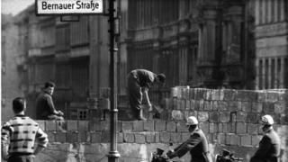 Going Up: a file picture of workers building the Berlin Wall in 1961