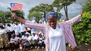 A Liberian woman prays for the end of Ebola in Monrovia, Liberia - 31 October 2014