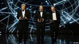 Fundamental Physics winners Brian Schmidt, Adam Riess, and Saul Perlmutter speak on stage during the 2nd annual Breakthrough Prize Awards