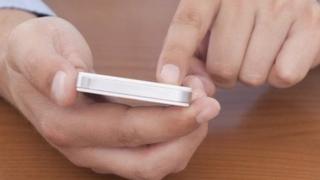 Man looking at smartphone