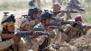 Iraqi Army personnel take part during an intensive security deployment against Islamic State militants in Jurf al-Sakhar, Iraq on 27 October 2014.