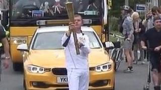 Benjamin Ridd carrying the torch