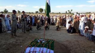Relatives and soldiers attend the funeral ceremony of Lance Naik Habib, a Pakistani Army soldier who was killed during clashes with militants in the Spin Qamar area of Khyber in Pakistan. 10 November 2014