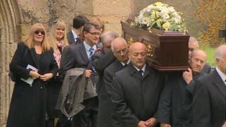 Acker Bilk's coffin is carried out of church