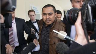 Malaysian diplomate Muhammad Rizalman Ismail, who is charged with attempted rape, is surrounded by journalists outside the Wellington District Court on 28 October 2014