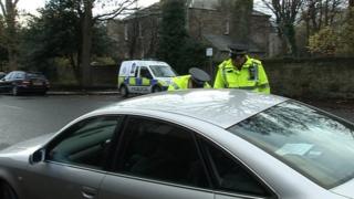 Police stopping motorists at scene