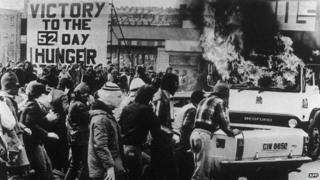 A group of young people sets fire on a van facing British troops in Belfast 22 April 1981