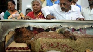Indian Christians pay their respects to the Saint Francis Xavier at the Se Cathedral, Goa - 22 November 2014