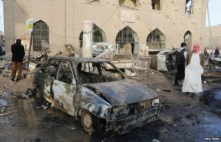 Aftermath of what activists said was a Syrian government air strike near the Raqqa museum on 25 November 2014