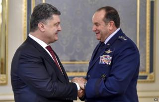 Ukrainian President Petro Poroshenko, left, greets U.S. European Command Commander, NATO Supreme Allied Commander Gen. Philip M. Breedlove in Kiev, Ukraine, Wednesday 26 November 2014