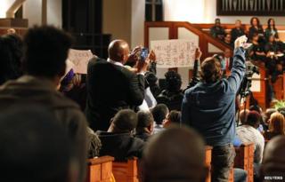 Protesters disrupt speech in Ebenezer Baptist Church during a forum titled "The Community Speaks" in Atlanta, Georgia December 1, 2014