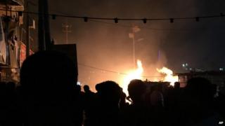 Fires burn after car bombings in Baghdad, 4 Dec