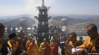 Monks hold a ceremony at a temple on Wutai Mountain