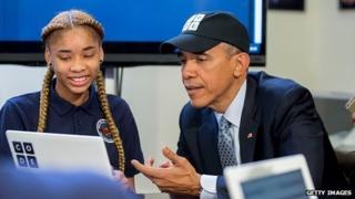 President Obama writing code with school child
