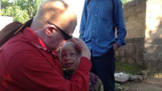 A community leader with a child in Ukerewe island, Tanzania (December 2014)