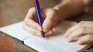 writing in a notebook