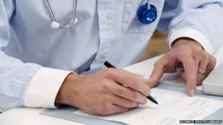Doctor writing notes