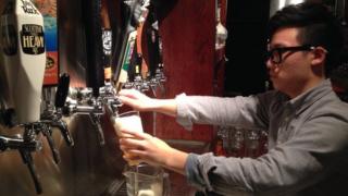 A man serving beer