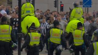 Police surround Newcastle United fans