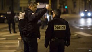 Police at the site where a driver targeted pedestrians in Dijon