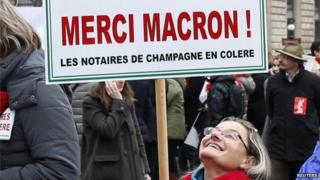 French lawyers, notaries and bailiffs attend a national protest against a government reform plan to deregulate their profession in Paris, 10 December 2014.