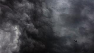 Plane flying through storm, file image
