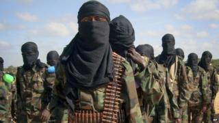 Armed members of the militant group al-Shabab attend a rally on the outskirts of Mogadishu, Somalia in this February 2012 file photo.