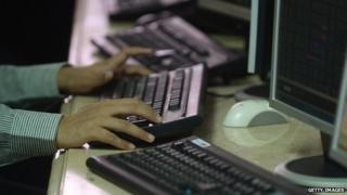 Hands on a computer in India