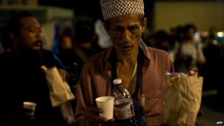 A homeless man at a soup kitchen