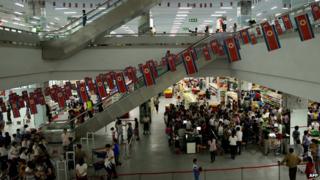 Customers shopping at a supermarket in Pyongyang