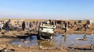 Photograph posted by the Local Co-ordination Committees, an opposition activist network, purportedly showing the aftermath of the air strike on a market in Khansaa, Syria (20 January 2015)