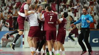 layers of the Qatari national team celebrate their win during the 24th Men's Handball World Championships quarterfinals match between Germany and Qatar at the Lusail Multipurpose Hall in Doha on January 28, 2015