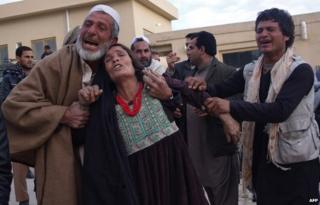 Afghan relatives weep for the victims as they arrive at the hospital following a suicide attack which targeted funeral prayers in Mehtar Lam city, of Laghman province on January 29