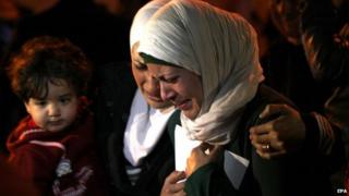 The wife (right) and sister (centre) of Moaz al-Kasasbeh protest in Amman, 28 January