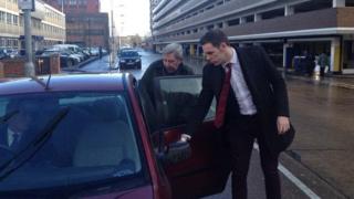 Robert Ray getting into car