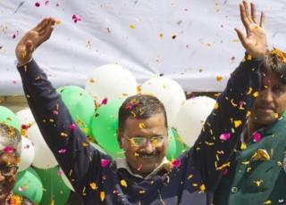 Leader of the Aam Aadmi Party, or Common Man's Party, Arvind Kejriwal waves to the crowd as his party looks set for a landslide party in New Delhi, India, Tuesday, Feb. 10, 2015
