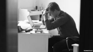 Teenage boy with laptop in room