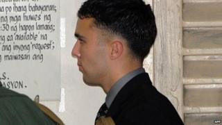US Marine Private First Class Joseph Scott Pemberton (C) leaves a court building in the Philippine city of Olongapo, 23 March 2015