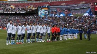 Argentina and El Salvador stand on the field during their national anthems during an International Friendly at FedExField