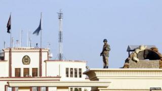 Soldier standing guard outside Almaza military airbase, where a military funeral of security personnel killed in attacks in Sinai is being held, 30 January 2015