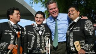 Governor Jeb Bush greets Mexican International Mariachi band members (L-R) Darwin Araujo, Alfredo Rojas and Douglas Cordero during a 'Florida - Mexico Cinco de Mayo Celebration: an Exchange of Cultures,' 5 May 2004