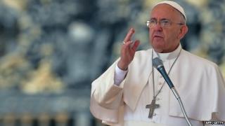 Pope Francis blesses people on 15 April 2014 during his weekly general audience at the Vatican